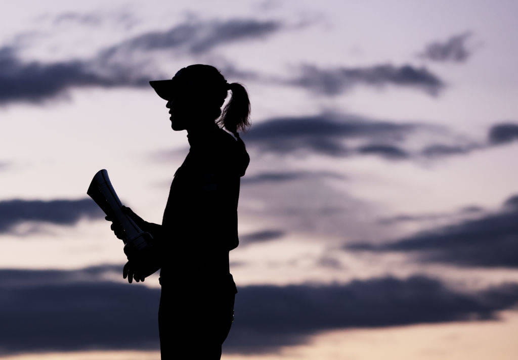 A silhouette as Lydia Ko of New Zealand (obscured) poses with the AIG Women's Open